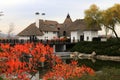 Rural landscape. Thatched roof house in autumn. Cottage in rustic style in leaf fall. Tourism in countryside. Dnipro, Ukraine Royalty Free Stock Photo