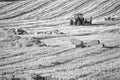 Rural landscape with tractor collecting hay