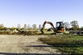 Rural landscape with a tractor , earth movers in field Royalty Free Stock Photo