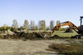 Rural landscape with a tractor , earth movers in field Royalty Free Stock Photo