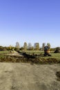 Rural landscape with a tractor , earth movers in field Royalty Free Stock Photo