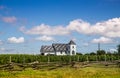 Rural landscape view. Old wood church and grapes field. Royalty Free Stock Photo