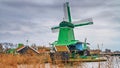 Rural landscape - view of the windmills on a cloudy winter day at the Zaanse Schan in the neighbourhood of Zaandam town, near Amst Royalty Free Stock Photo