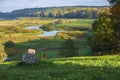 Rural landscape with views the windmill river and fields. Pushkin Hills with Savkina Gorka. Russia Pskov region in early