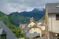 Roofs and bell tower of St. Peter`s church in Cette-Eygun, a small french village in the Pyrenees. Royalty Free Stock Photo