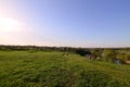 A rural landscape with a wild reed field and a small lake. Ecologically clean place for res Royalty Free Stock Photo