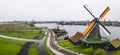 Rural landscape with windmill in Zaanse Schans. Holland, Netherlands. Authentic Zaandam mill. Beautiful Netherland Royalty Free Stock Photo