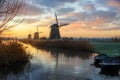 Rural landscape with windmills in Holland at sunrise
