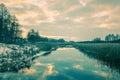 View of a brook and cloudy sky at sunset