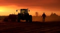 Rural landscape with a working tractor on the field.Agricultural land annually cultivated crops perennial grasses