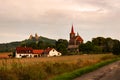 Rural landscpe with farmstead, church and castle ruin Trosky Royalty Free Stock Photo