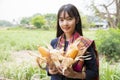 Rural life style concept. Girls in rural Thailand holding corn harvested in the fields