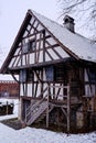 Old half-timbered house, historic peasant home, snowy winter season scene Royalty Free Stock Photo