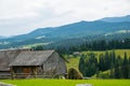 Rural log shed and Carpathian landscape Royalty Free Stock Photo
