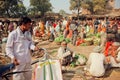 Rural market in India full of villagers buying vegetables and greens