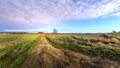 Rural Maryland Farm Landscape with long Dirt Road leading to a Red Barn Royalty Free Stock Photo
