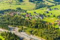 Rural mountain landscape. View of the houses in Bialka Tatrzanska on the river, in which tourists rent accommodation during the ho