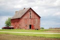 A rural old, red barn with a red pickup truck. Royalty Free Stock Photo