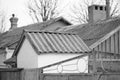 Rural old roofs covered with corrugated asbestos cement sheet, bw photo