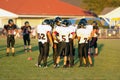 A rural Oregon high school foot ball team in a huddle Royalty Free Stock Photo