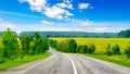 Rural paved road among fields Royalty Free Stock Photo