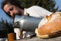 Rural picnic with milk churn and bread Royalty Free Stock Photo