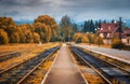 Rural railway station in autumn in cloudy day. Industrial