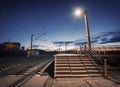 Rural railway station at night with blue sky. Railroad