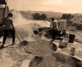 Man working in a factory boiling sugar cane.
