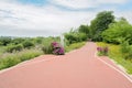 Rural red-painted path in cloudy summer afternoon Royalty Free Stock Photo