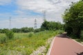 Rural red-painted way in cloudy summer afternoon Royalty Free Stock Photo