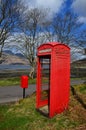 Rural Red phone box in scottish landscape Royalty Free Stock Photo