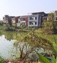 rural river with its banks covered with bushes