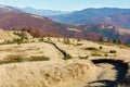 Rural road in autumn mountain. Royalty Free Stock Photo