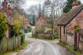 Rural Road With Brick Buildings and Wooden Fence Royalty Free Stock Photo