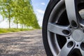 Rural Road Car Safety Wheel on Sunny Morning