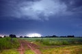 Rural road and dark storm clouds