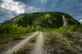 Rural road with small vegetation and cliffs Royalty Free Stock Photo