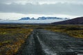 Rural road in icenad with mountiain landscape