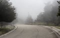 Rural road (Kefalonia island, Greece) on a foggy day Royalty Free Stock Photo