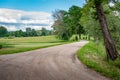 Rural road leading through the fields. Royalty Free Stock Photo