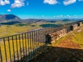 Rural road in middle of a green grass field in Andalusia Royalty Free Stock Photo