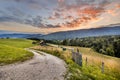 Rural road in mountain landscape in French Alps Royalty Free Stock Photo