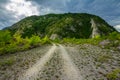 Rural road with small vegetation and cliffs Royalty Free Stock Photo