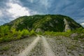 Rural road with small vegetation and cliffs Royalty Free Stock Photo