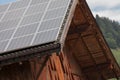 Rural scene of an alpine barn with photovoltaic panels Royalty Free Stock Photo