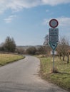 Rural small road with German traffic signs