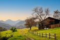 Rural southern California landscape with fenced wooden hut.