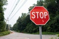 Rural Stop Sign in Cold Spring New York along an Empty Road with Green Trees