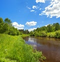 Rural summer landscape with forest, river, blue sky and white cl Royalty Free Stock Photo